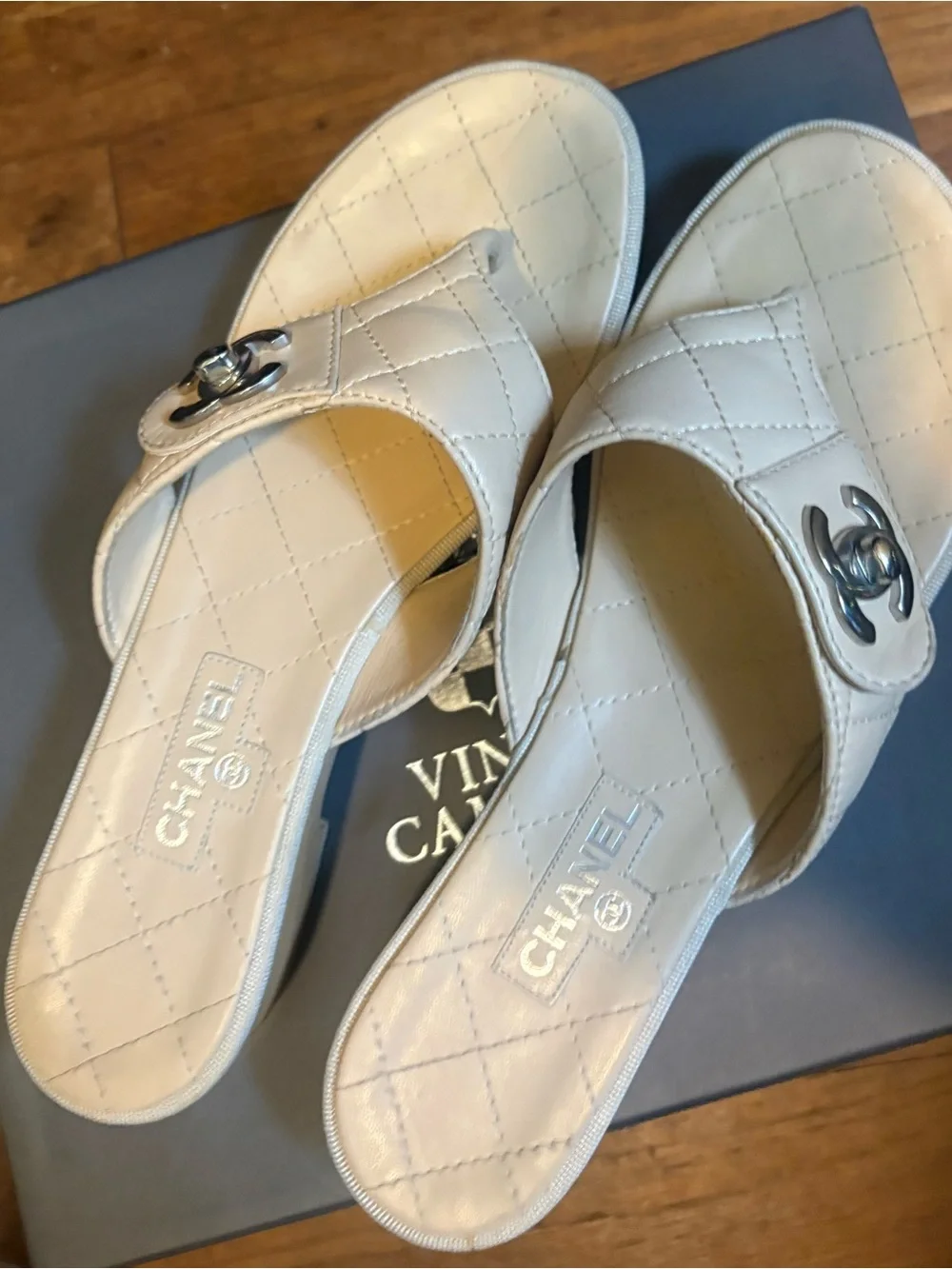 CHANEL Quilted Leather Thong Mules in Cream with Silver CC Logo